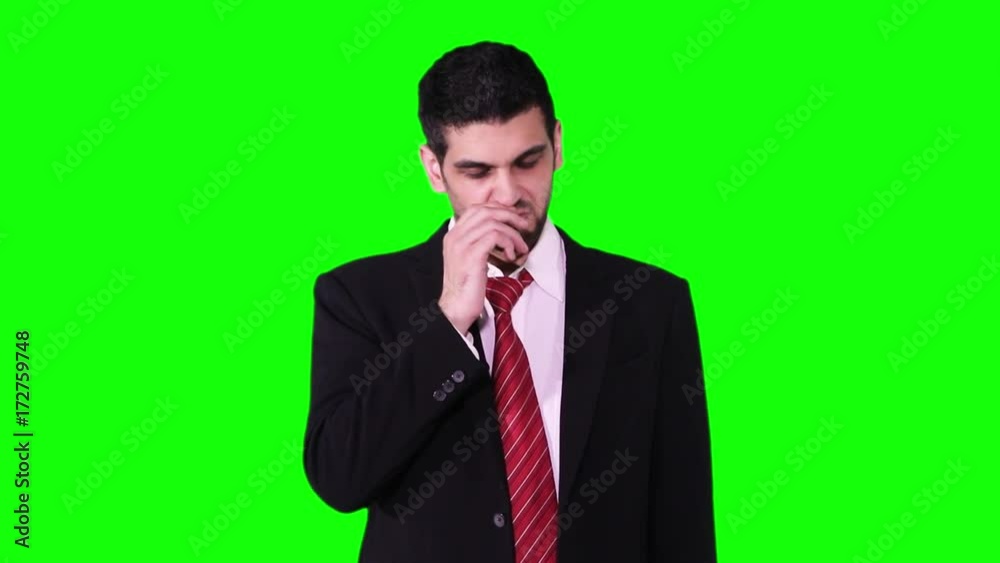 Young Caucasian businessman sneezing in the studio while wearing formal wear and standing against green screen background Young Caucasian businessman sneezing in the studio while wearing formal wear and standing against green screen background