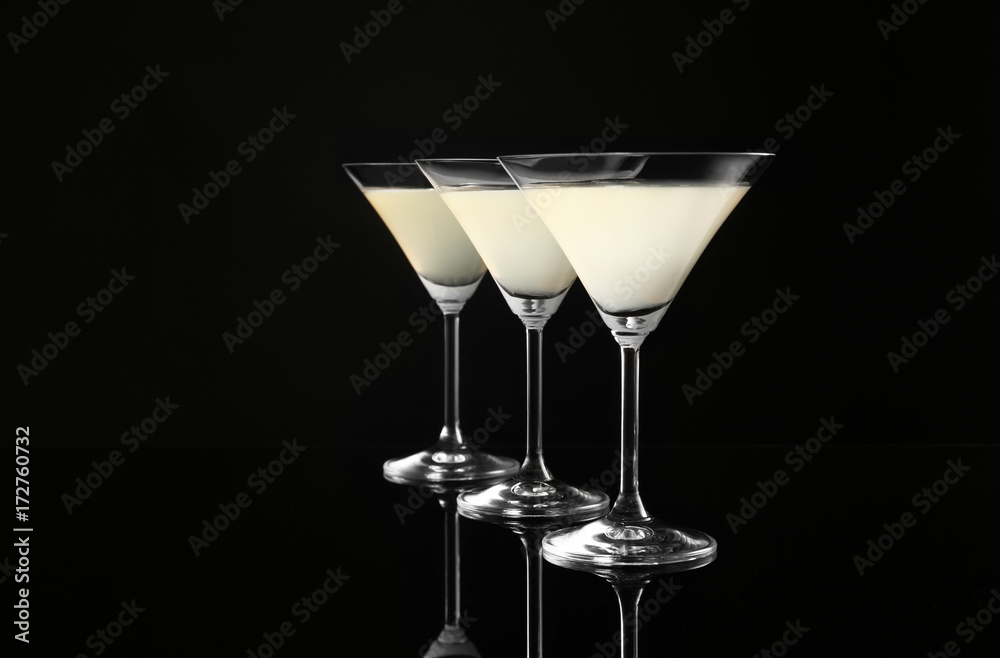Glasses of lemon drop martini on black background Glasses of lemon drop martini on black background