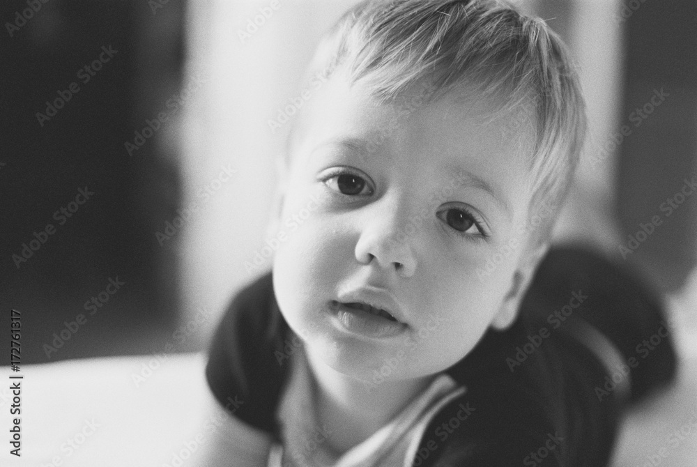Close up portrait of a young boy looking at the camera Close up portrait of a young boy looking at the camera