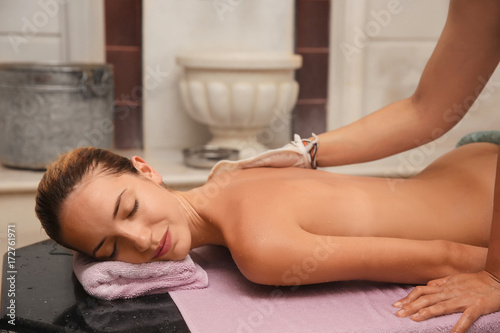 Slim beautiful woman in hammam