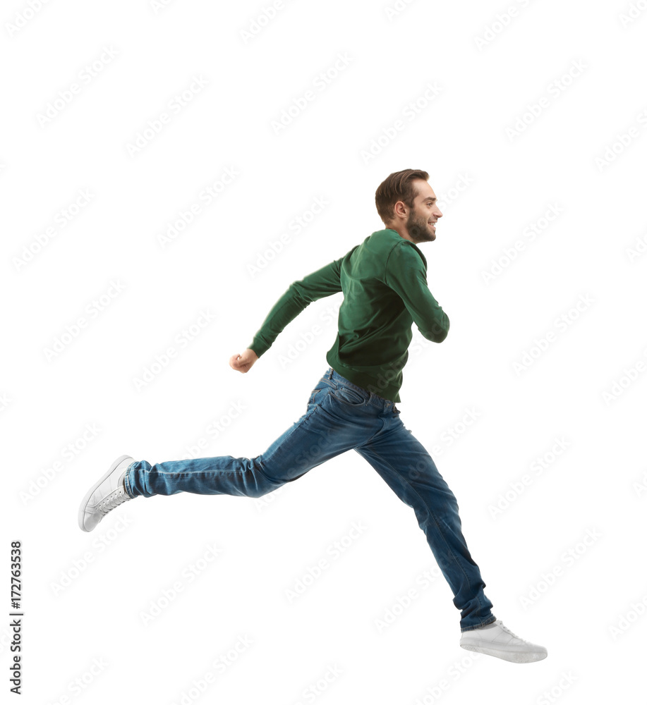 Young man in casual clothes running on white background Young man in casual clothes running on white background