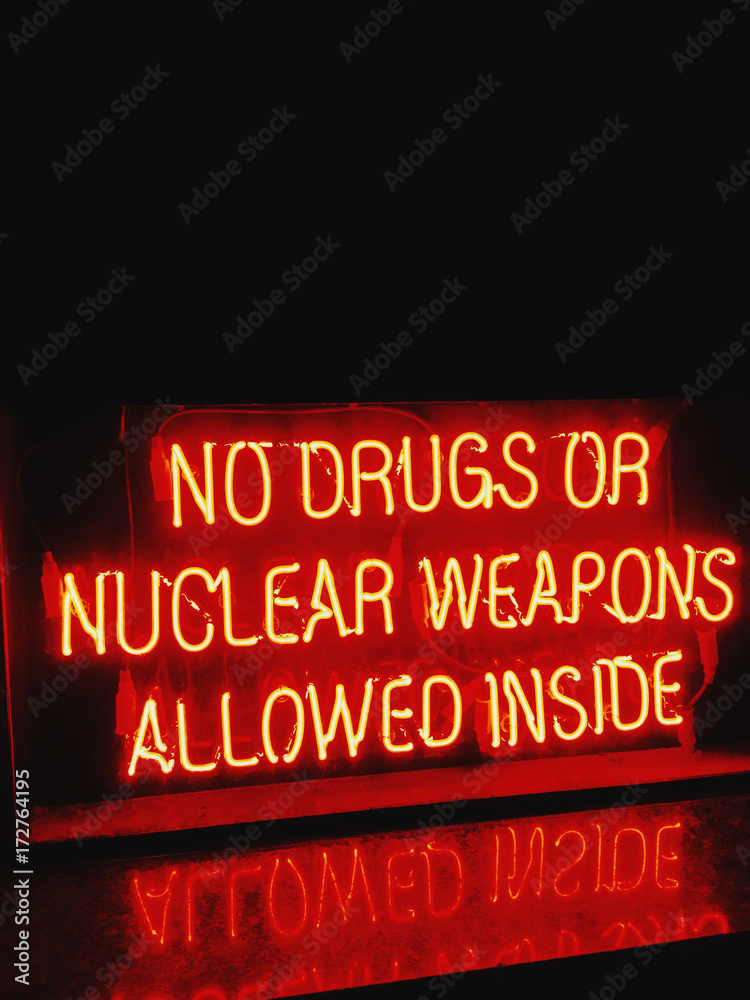 No Drugs or Nuclear Weapons Allowed Inside neon sign Stock Photo