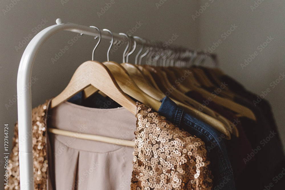 © Carey Shaw/Stocksy - Sequin pink jacket hanging on clothing rack © Carey Shaw/Stocksy - Sequin pink jacket hanging on clothing rack