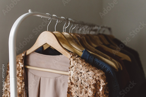 Sequin pink jacket hanging on clothing rack