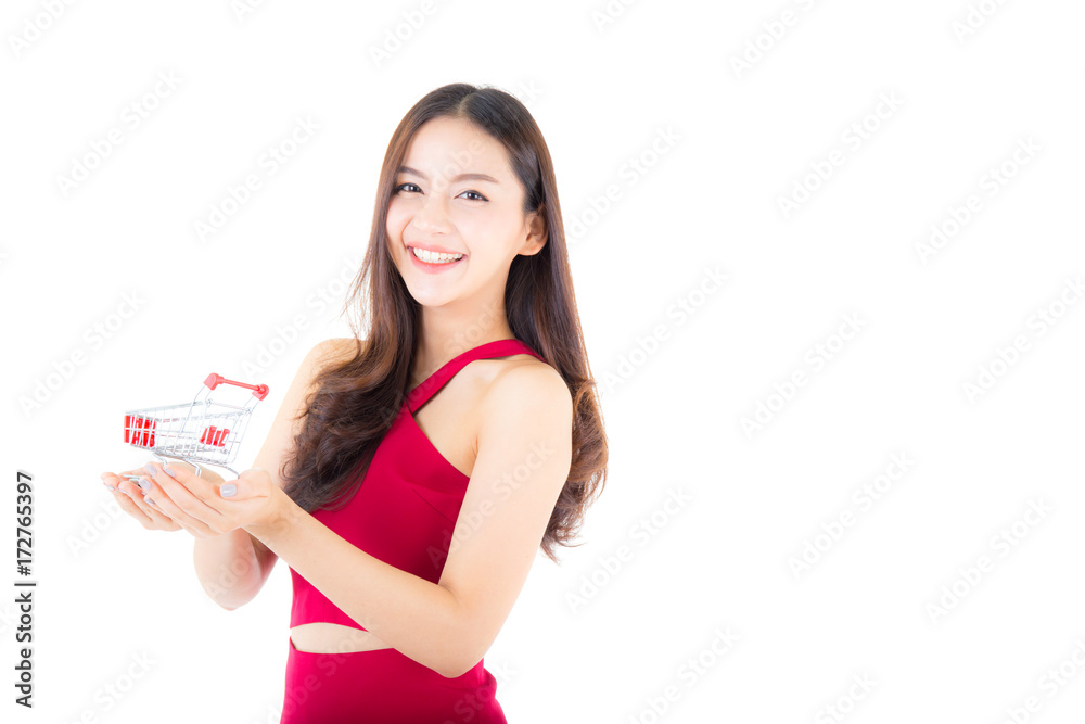 Smiling asian woman in red dress holding shopping cart with girl isolated on white background, shopping online concept. Smiling asian woman in red dress holding shopping cart with girl isolated on white background, shopping online concept.