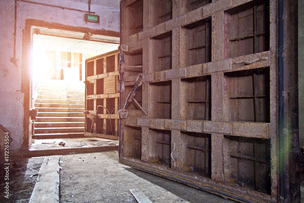 Big rusty heavy steel hermetic doors in the abandoned Soviet bomb shelter Big rusty heavy steel hermetic doors in the abandoned Soviet bomb shelter