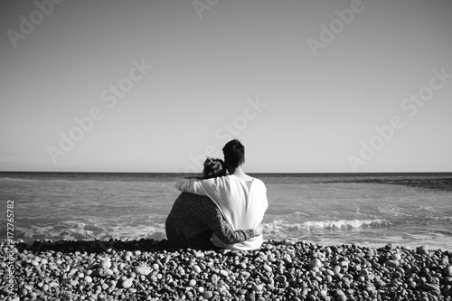 Couple embracing on the beach photo