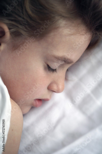 Profile View Of Little Girl Sleeping photo