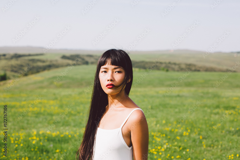 Beautiful Asian young woman enjoying summertime in the nature Beautiful Asian young woman enjoying summertime in the nature