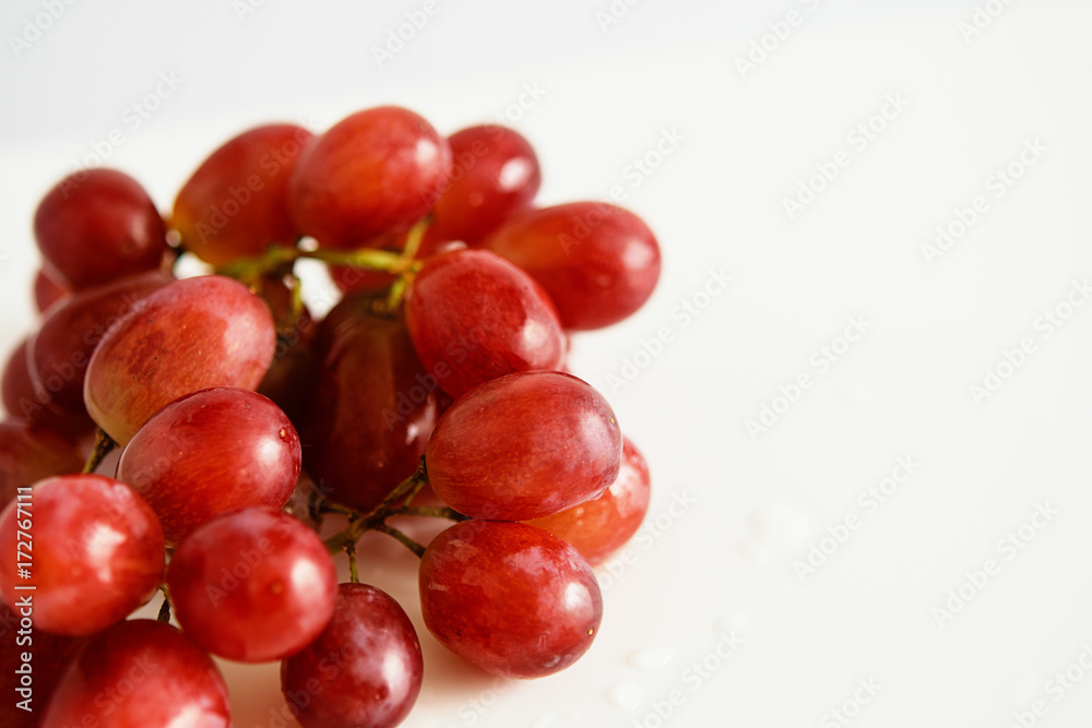 Red grapes. Close up. White background