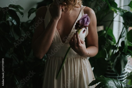 Moody bridal portraits in a tropical botanical flower shop photo
