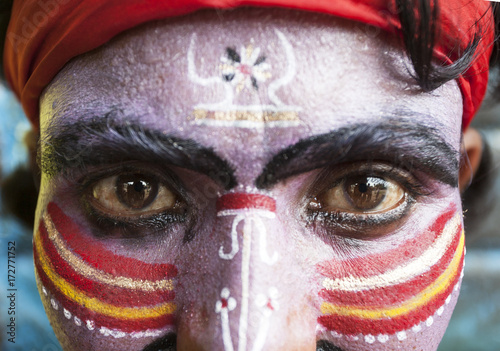 Close view of an Indian man with painted face