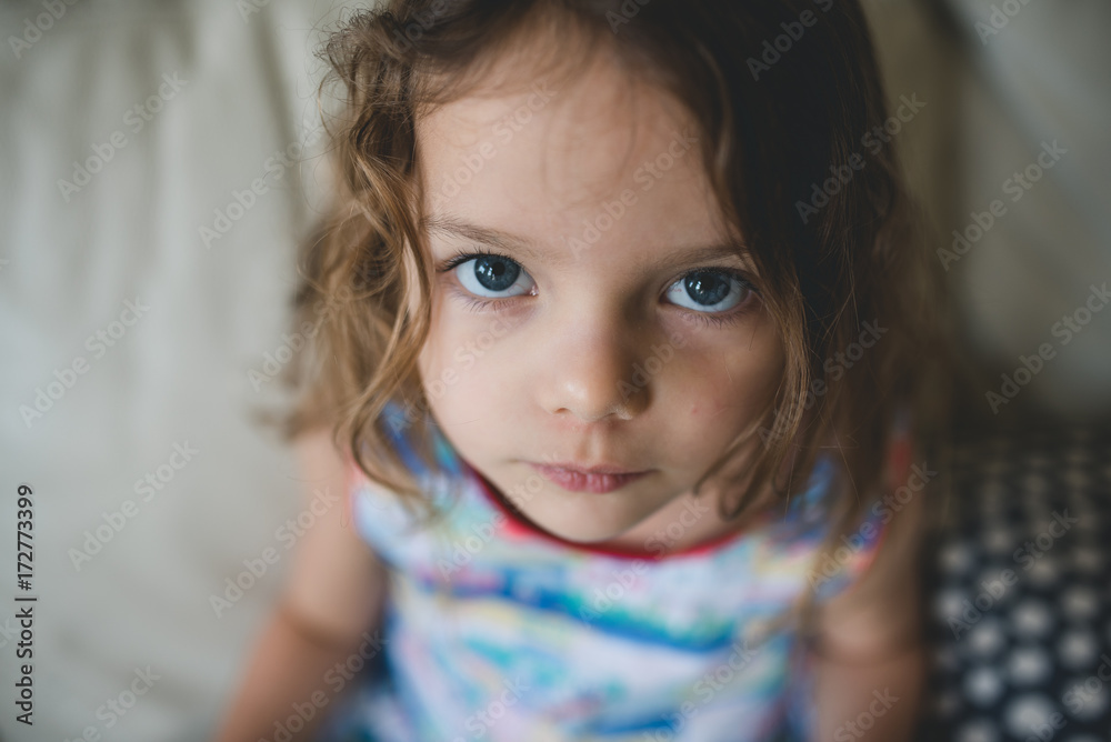 Little girl giving puppy dog eyes