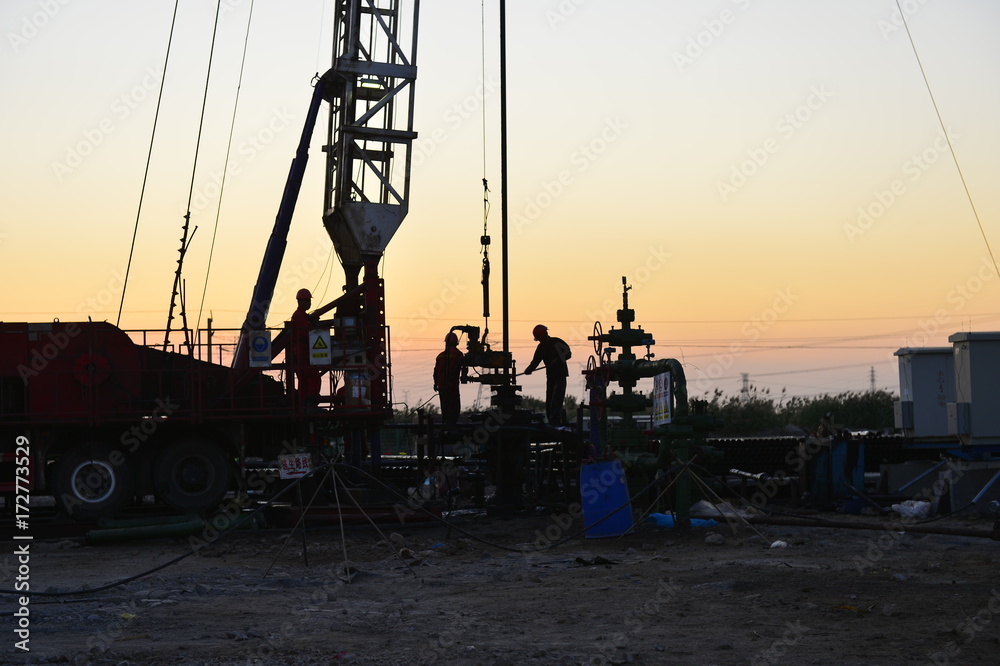 field oil workers at work