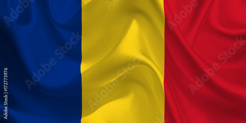 Waving flag of the Romania. Romanian Flag in the Wind. Romanian National mark. Waving Romania Flag. Romania Flag Flowing.