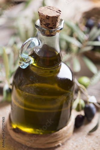 Fototapeta Naklejka Na Ścianę i Meble -  Olive oil and olives on wooden rustic table