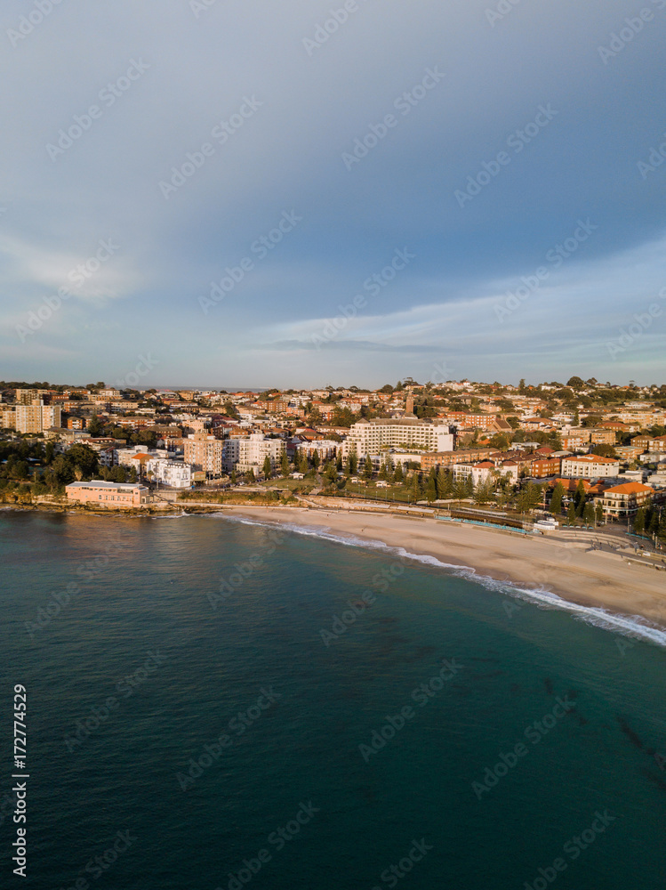 Aerial view of Coogee Beach with cloudy sky.