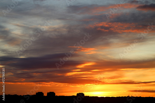 Photo of a brightly beautiful sunset with clouds