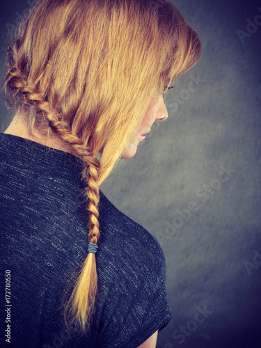 Woman with blonde hair and braid hairdo