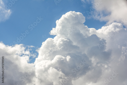 White fluffy clouds in blue sky