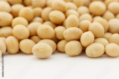 pile of dried soy beans on white background
