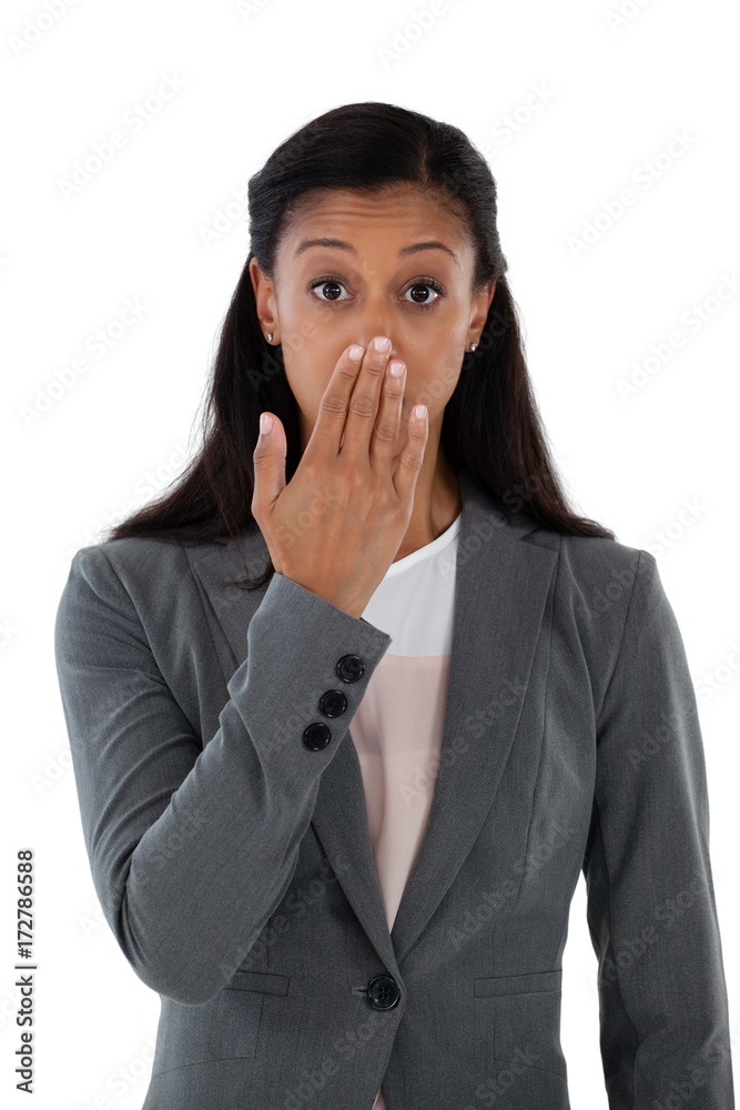 Surprised businesswoman covering her mouth with hand Surprised businesswoman covering her mouth with hand