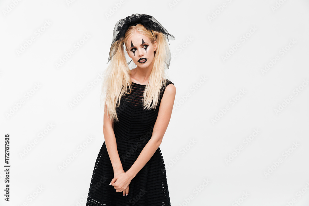 Pretty blonde woman dressed in black widow costume Pretty blonde woman dressed in black widow costume