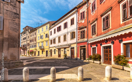 Street with colorful facade of an old houses in Pula, Croatia, Europe.