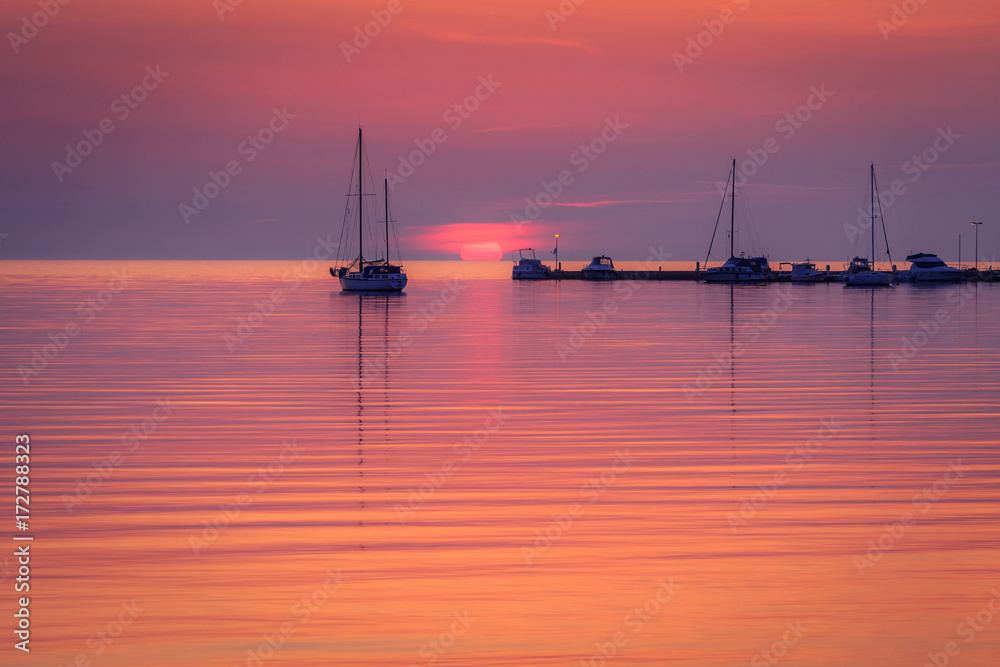 Sunset with silhouettes of ships on the Adriatic sea, The Green lagoon in Porec - Istria, Croatia, Europe.
