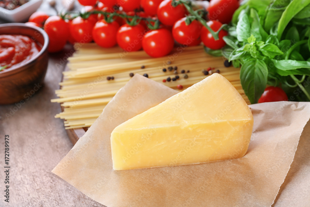 Tasty cheese on wooden table