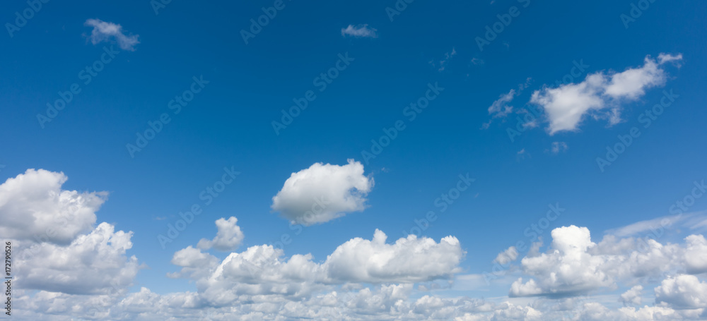 Beautiful blue sky with clouds over horizon. Panorama of a blue sky.