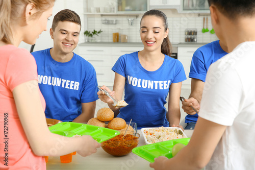 Teen volunteers serving foo...