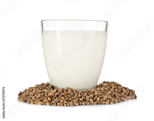 Glass with hemp milk isolated on white
