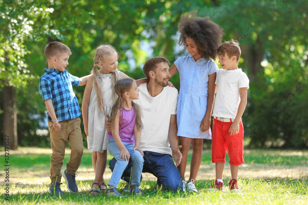 Group of children with teacher in park