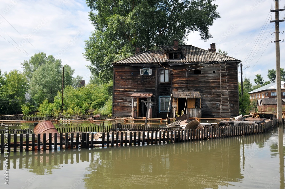 Fototapeta premium Flood. The river Ob, which emerged from the shores, flooded the outskirts of the city.