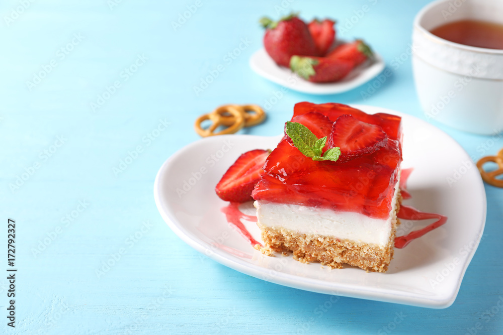 Plate with delicious strawberry pretzel salad on table Plate with delicious strawberry pretzel salad on table
