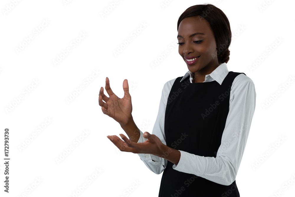 Happy woman gesturing against white background Happy woman gesturing against white background