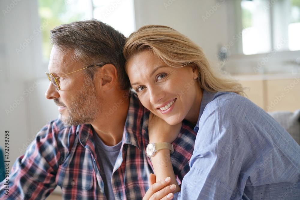 Portrait of mature couple relaxing at home Portrait of mature couple relaxing at home