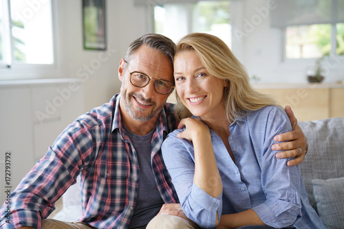 Portrait of mature couple relaxing at home © goodluz