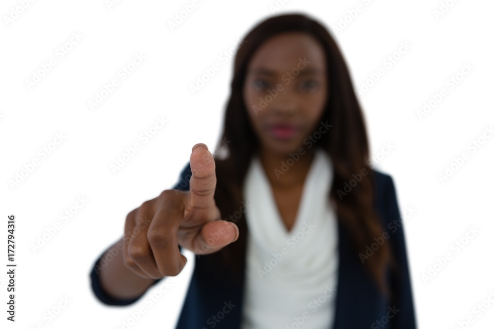 Young businesswoman touching imaginary screen Young businesswoman touching imaginary screen