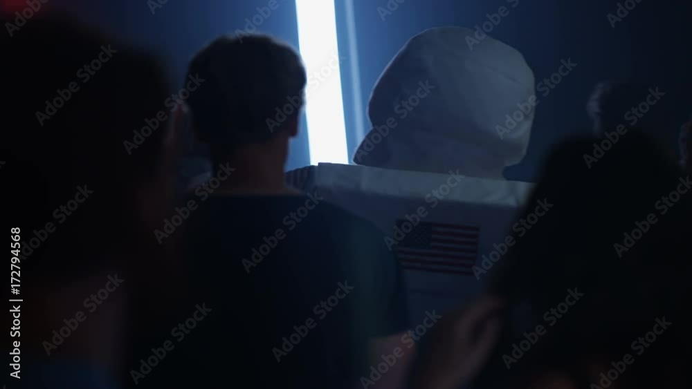 Party crowd dancing in the club, funny astronaut dancing & kissing a girl Party crowd dancing in the club, funny astronaut dancing & kissing a girl
