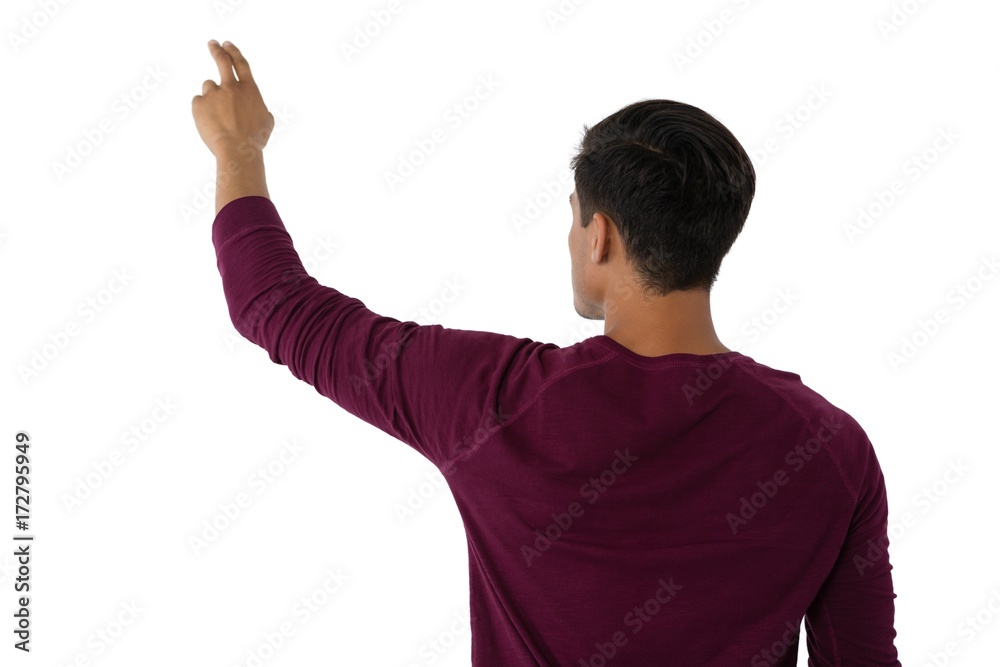 Businessman touching invisible imaginary screen Businessman touching invisible imaginary screen