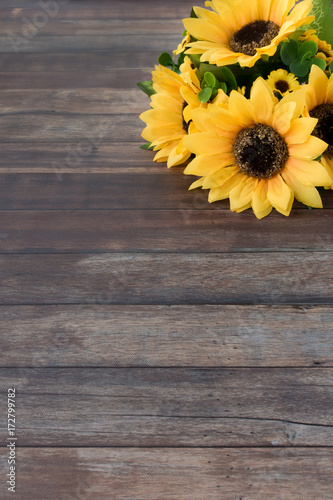 Fototapeta Naklejka Na Ścianę i Meble -  Sunflower Bouquet on Dark Brown Wooden Background