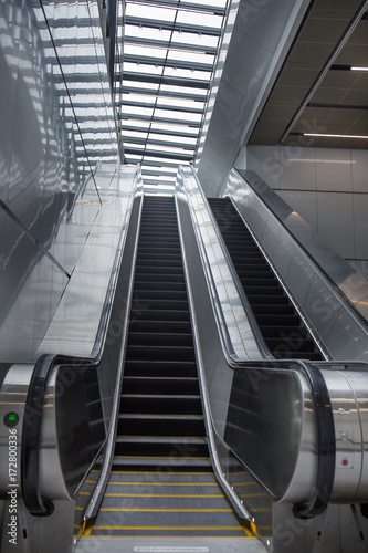 Empty escalator in modern train station.