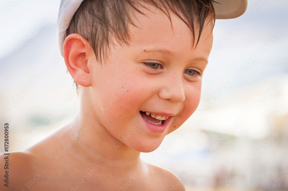 Happy cute Caucasian boy sweating in the summer heat smiling at his parents. Happy cute Caucasian boy sweating in the summer heat smiling at his parents.
