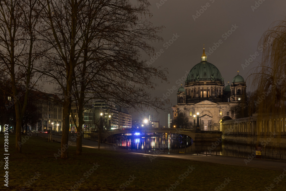 Night time photo of the Berlin Cathedral, shot from Museum Island and including the Spree