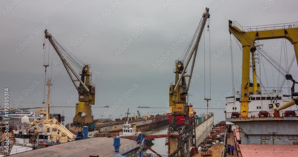 Icebreaker ship enters the floating dock for repair at shipyard. Tugboats haul ship for recontruction. Ship reconstruction process 4k timelapse video at Sea of Azov. Icebreaker ship enters the floating dock for repair at shipyard. Tugboats haul ship for recontruction. Ship reconstruction process 4k timelapse video at Sea of Azov.