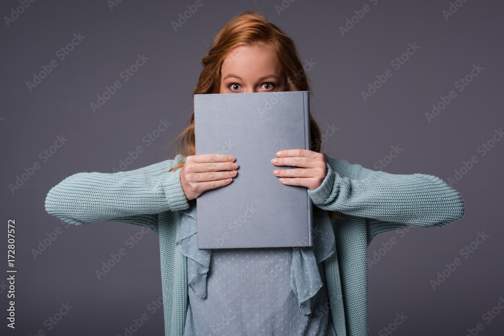 girl holding book girl holding book