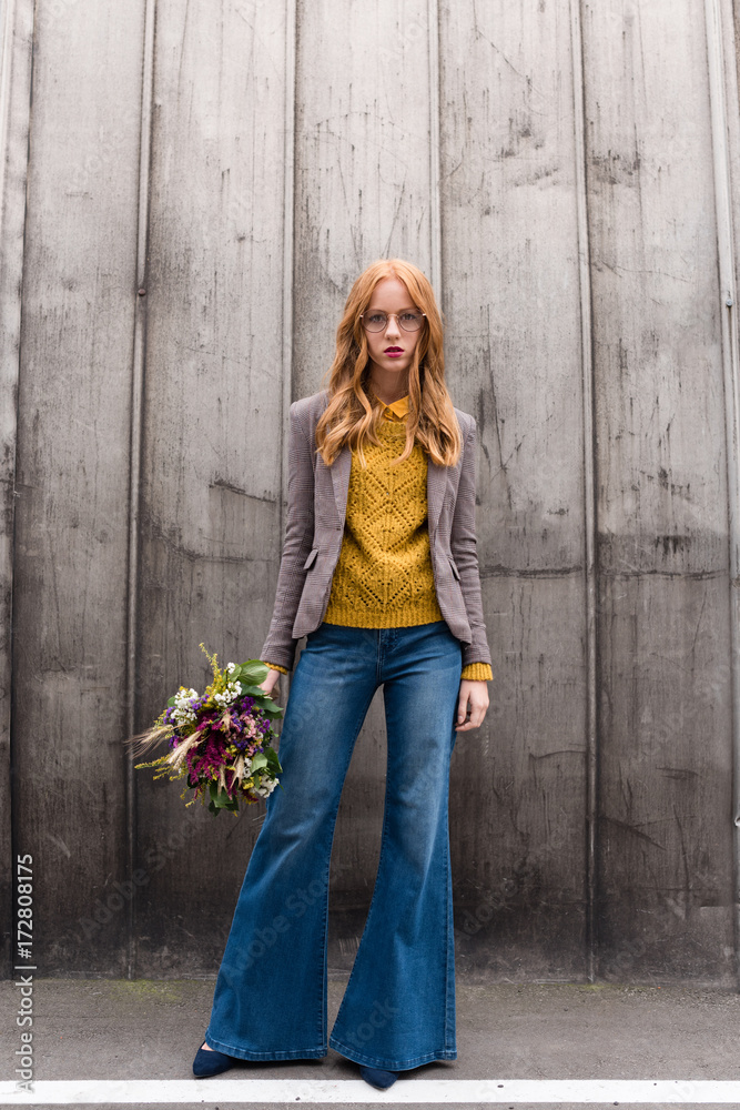 redhead girl with bouquet of flowers