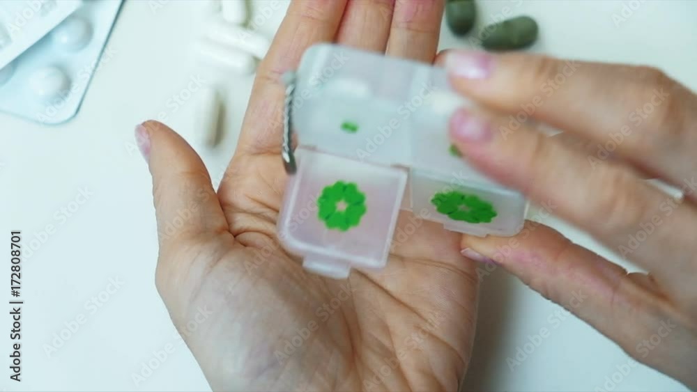 Woman fingering pills in her hand, Tablet in hand, Woman fingering pills in her hand, Tablet in hand,